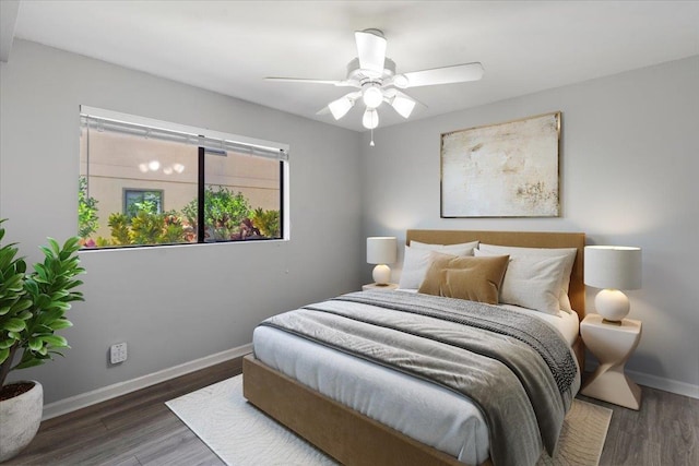 bedroom featuring ceiling fan and hardwood / wood-style flooring