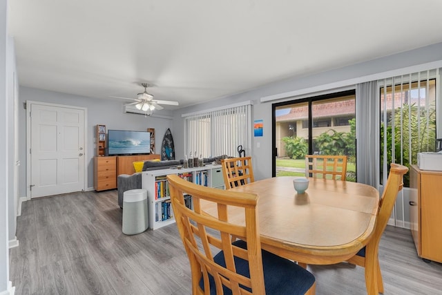 dining space featuring ceiling fan and light hardwood / wood-style floors