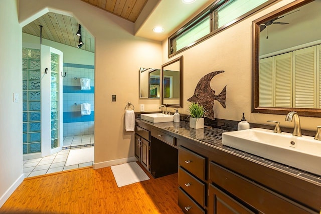 bathroom featuring wood ceiling, vanity, ceiling fan, a shower, and hardwood / wood-style floors