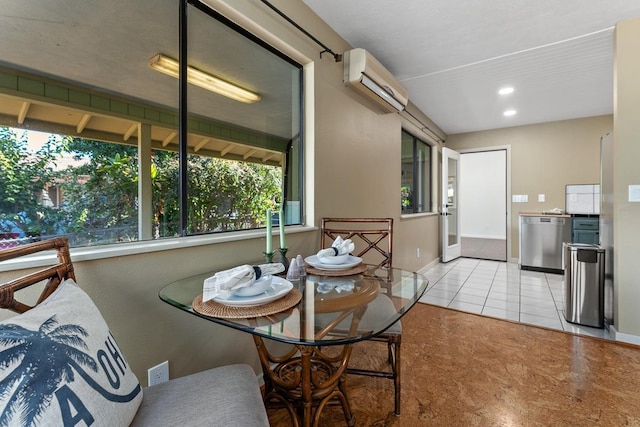 tiled dining space with a wall mounted AC