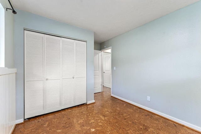 unfurnished bedroom featuring a closet