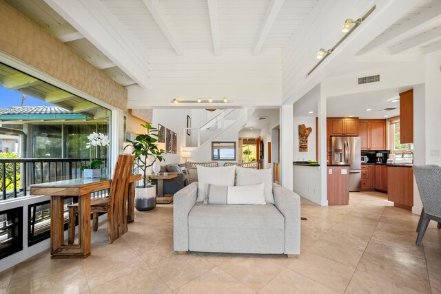 500 Bay Dr Unit 28B2, Lahaina, HI 96761 - living area with healthy amount of natural light, beamed ceiling, and light tile patterned floors