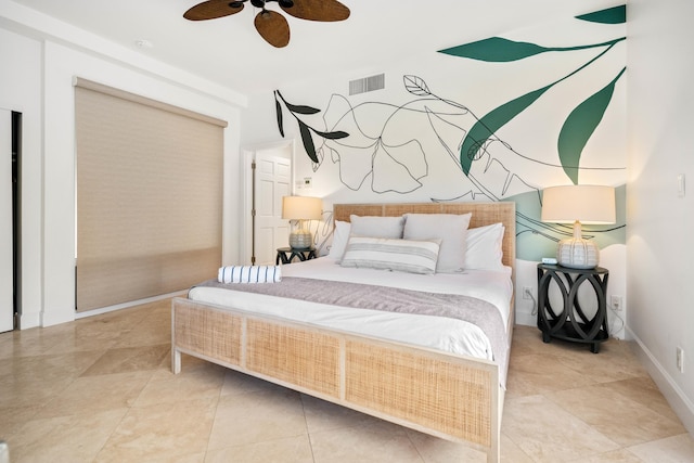 tiled bedroom featuring ceiling fan