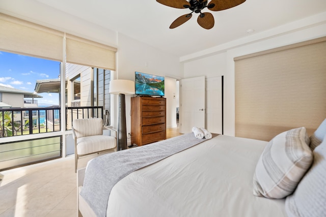 bedroom with light tile patterned floors, access to outside, and ceiling fan