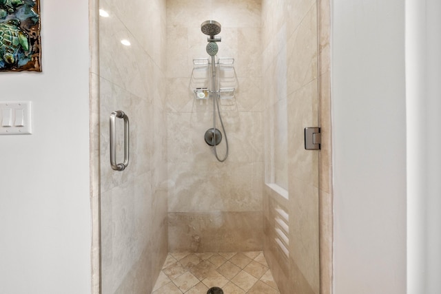 bathroom with a shower with shower door