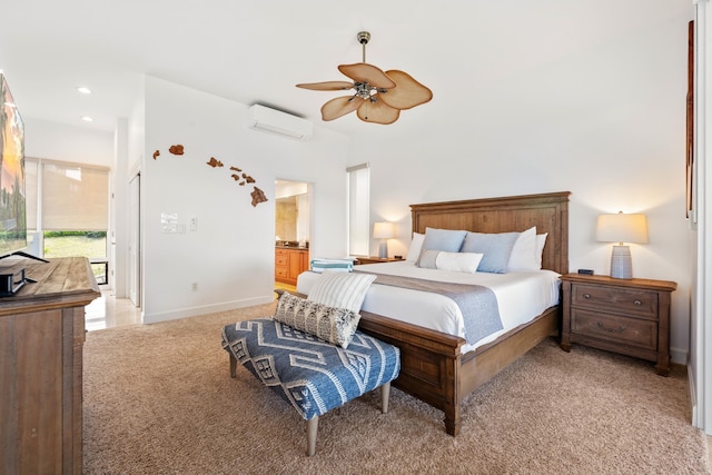 bedroom featuring a wall mounted air conditioner, ensuite bathroom, access to outside, light colored carpet, and ceiling fan