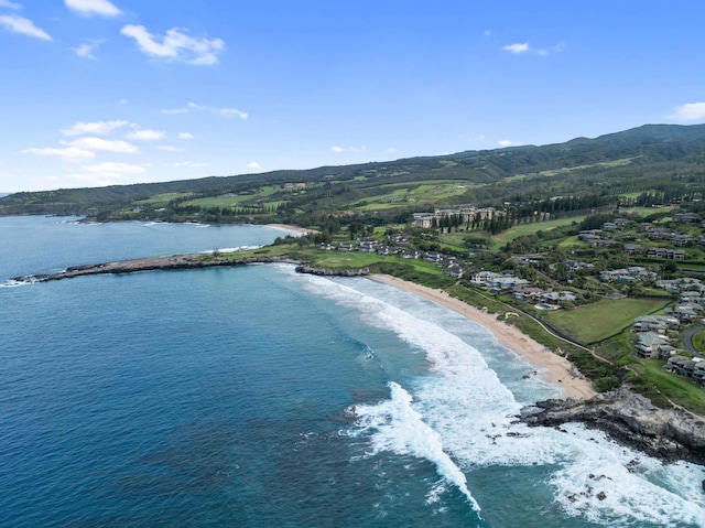 drone / aerial view featuring a water and mountain view