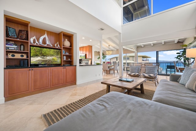 500 Bay Dr Unit 28B2, Lahaina, HI 96761 - living room featuring light tile patterned flooring and beamed ceiling