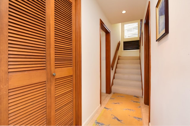 hall featuring light tile floors