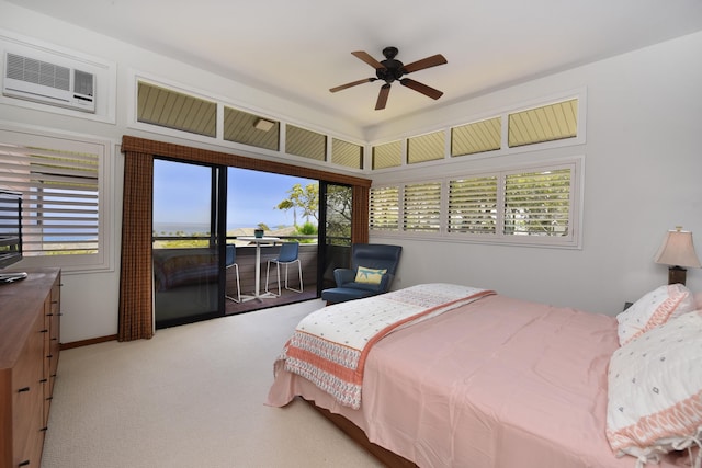 bedroom featuring light carpet, access to outside, ceiling fan, and a wall mounted air conditioner