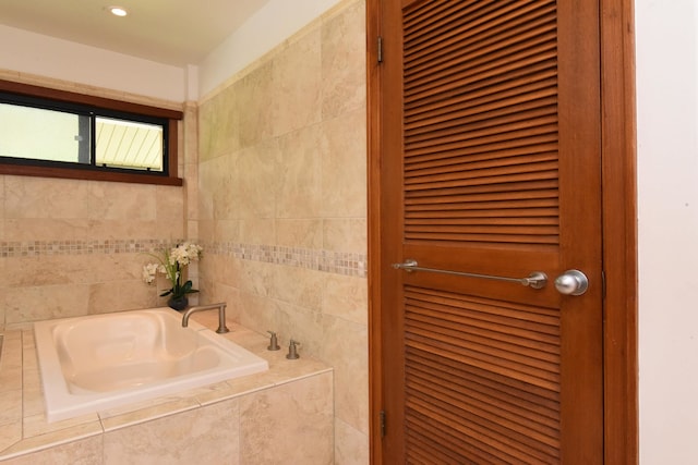 bathroom with tiled bath