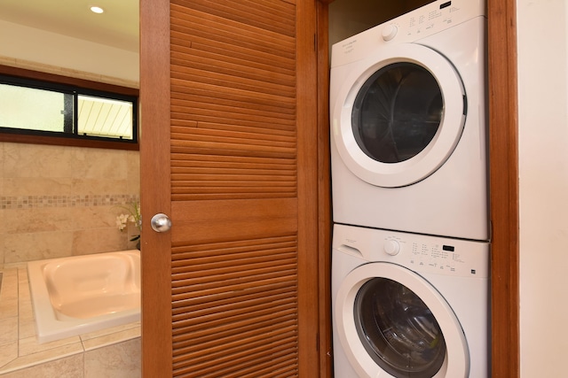 washroom with stacked washer / drying machine