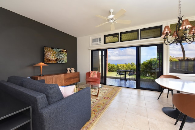 tiled living room with ceiling fan with notable chandelier