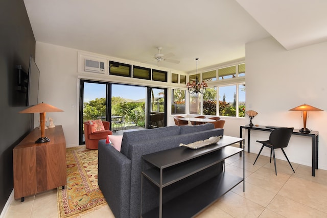 tiled living room with ceiling fan with notable chandelier