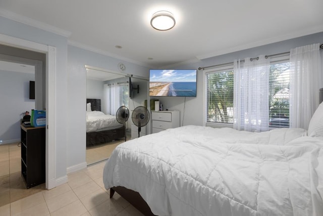 bedroom featuring light tile patterned floors and ornamental molding