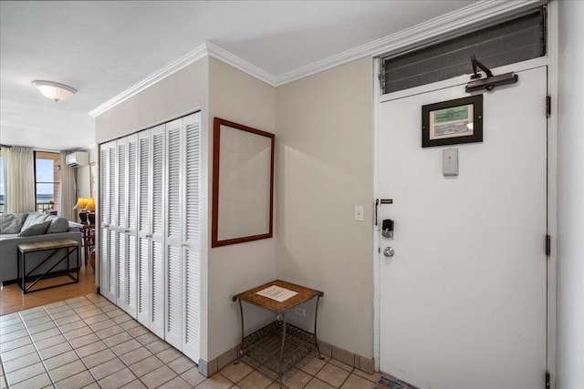 800 S Kihei Rd Unit 504, Kihei, HI 96753 - entrance foyer with light tile patterned flooring, ornamental molding, baseboards, and an AC wall unit