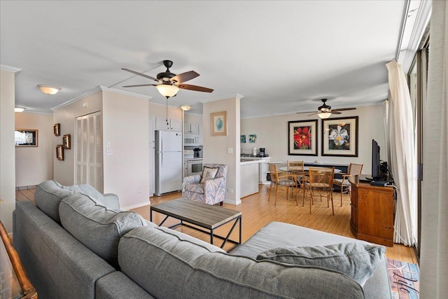800 S Kihei Rd Unit 504, Kihei, HI 96753 - living room with ceiling fan, crown molding, and light wood-type flooring
