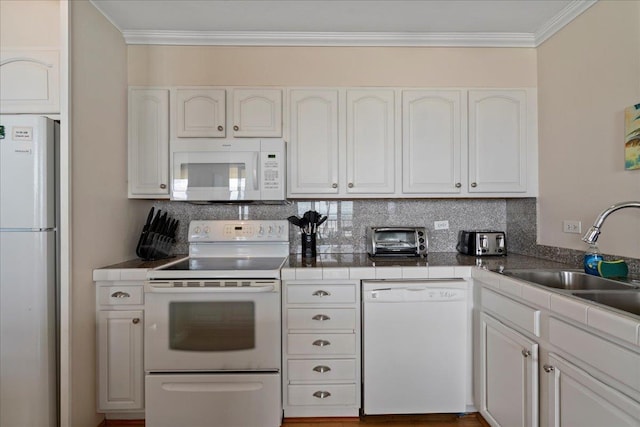 800 S Kihei Rd Unit 504, Kihei, HI 96753 - kitchen with white appliances, a sink, ornamental molding, decorative backsplash, and tile countertops