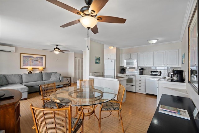 800 S Kihei Rd Unit 504, Kihei, HI 96753 - living room with a wall mounted AC, a ceiling fan, crown molding, and light wood finished floors