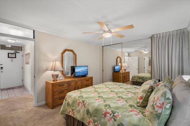 800 S Kihei Rd Unit 504, Kihei, HI 96753 - bedroom featuring light carpet, crown molding, ceiling fan, and a closet