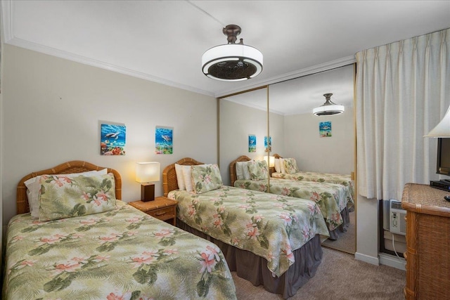 800 S Kihei Rd Unit 504, Kihei, HI 96753 - bedroom with ornamental molding, carpet, a wall mounted AC, baseboards, and a closet
