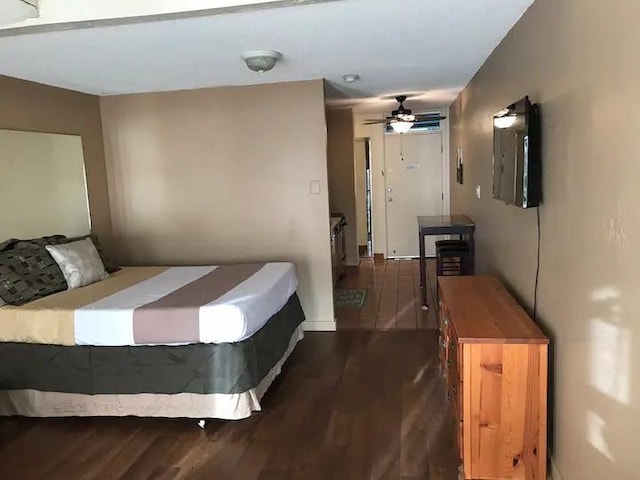 bedroom with hardwood / wood-style flooring and ceiling fan