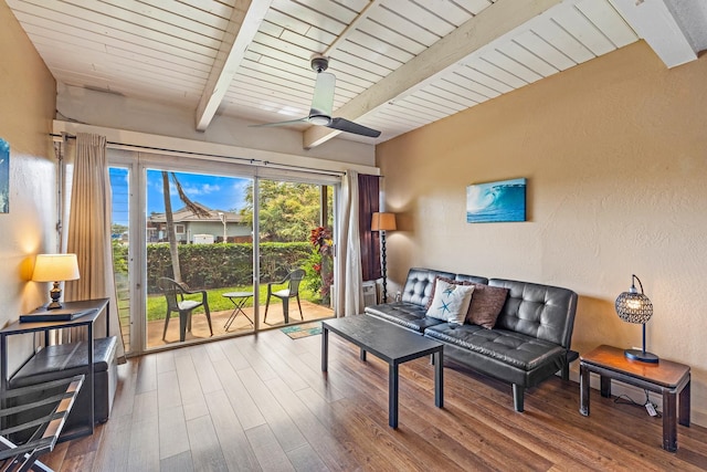 sunroom / solarium with beam ceiling and ceiling fan