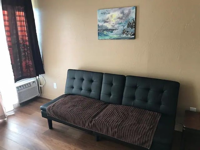 living area with wood-type flooring