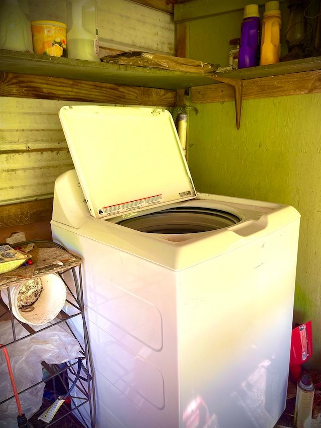 clothes washing area with washer / dryer