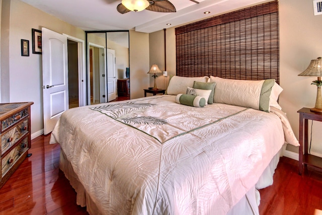 bedroom featuring dark hardwood / wood-style flooring and ceiling fan