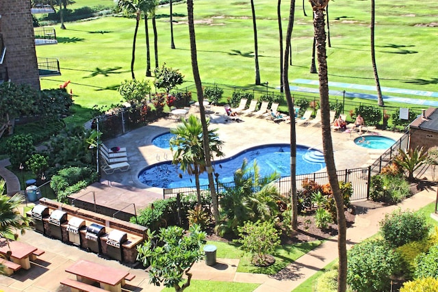 view of pool with a yard and a patio