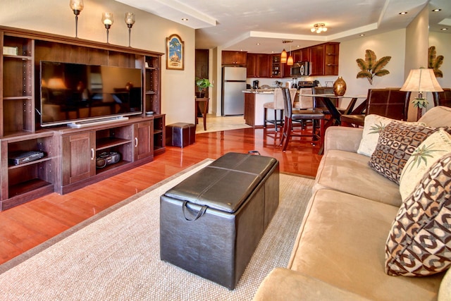 living room with light hardwood / wood-style flooring