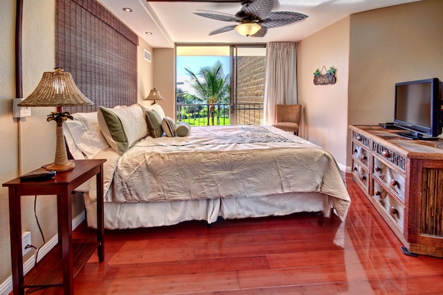 bedroom featuring access to outside, ceiling fan, and wood-type flooring