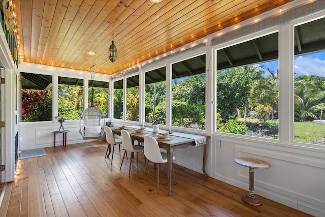 unfurnished sunroom with wooden ceiling