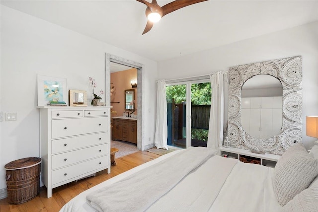 bedroom with a ceiling fan, connected bathroom, light wood-style flooring, access to outside, and a sink