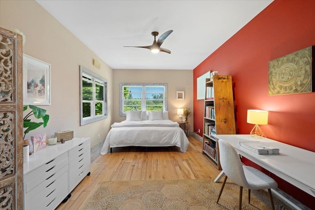 bedroom featuring light wood finished floors and a ceiling fan