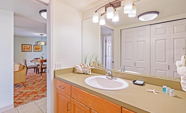 bathroom with tile patterned flooring and vanity