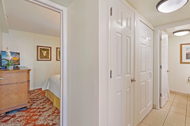 hallway featuring light tile patterned flooring