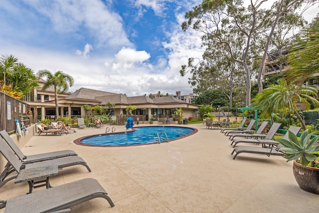 view of pool featuring a patio