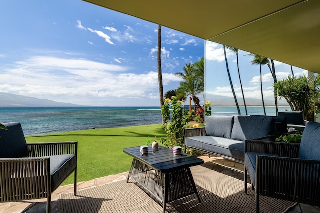 100 Hauoli St Unit 106, Wailuku, HI 96793 - view of patio / terrace with an outdoor living space and a water and mountain view