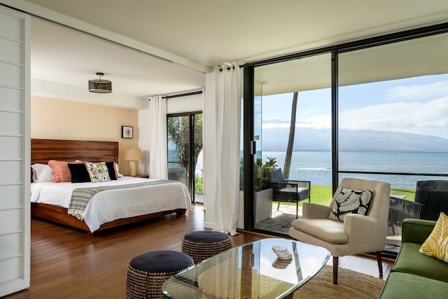 100 Hauoli St Unit 106, Wailuku, HI 96793 - bedroom featuring a water view, access to exterior, wood finished floors, and floor to ceiling windows