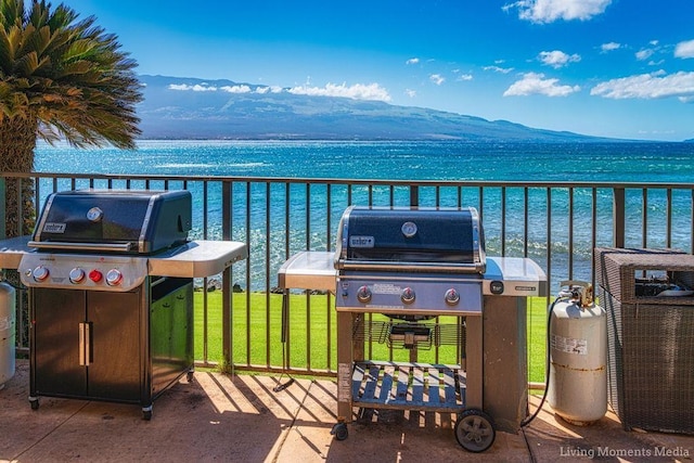 100 Hauoli St Unit 106, Wailuku, HI 96793 - balcony featuring a water and mountain view and area for grilling