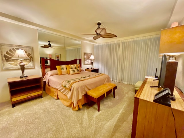 carpeted bedroom featuring ceiling fan