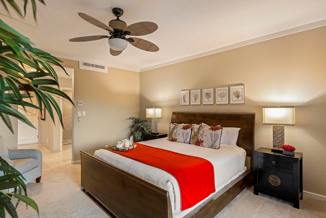 bedroom with crown molding, light carpet, and ceiling fan