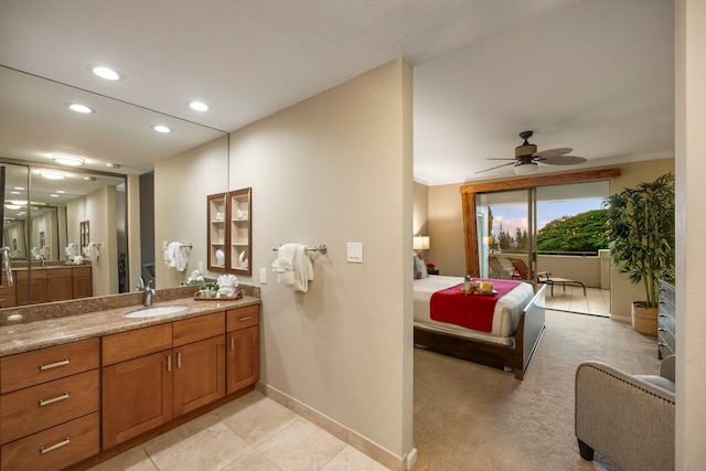 bathroom featuring vanity, ceiling fan, and tile patterned floors