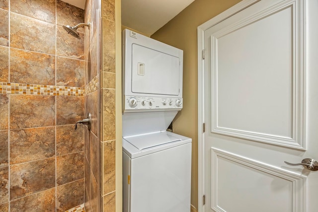 laundry room featuring stacked washer / drying machine