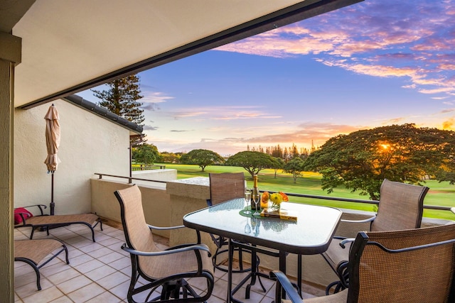 view of patio terrace at dusk