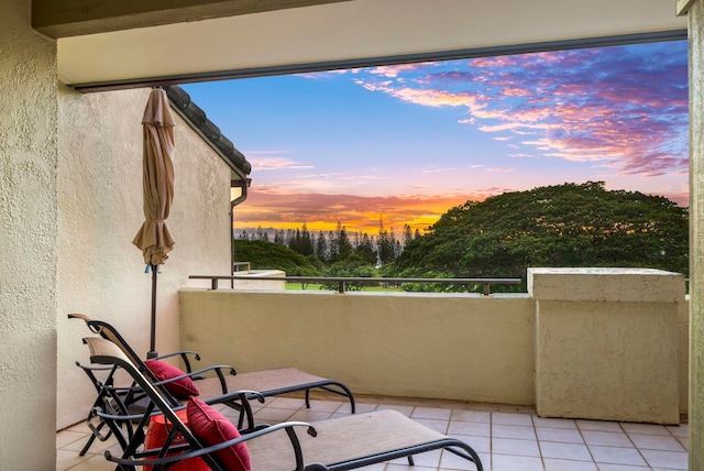 view of balcony at dusk