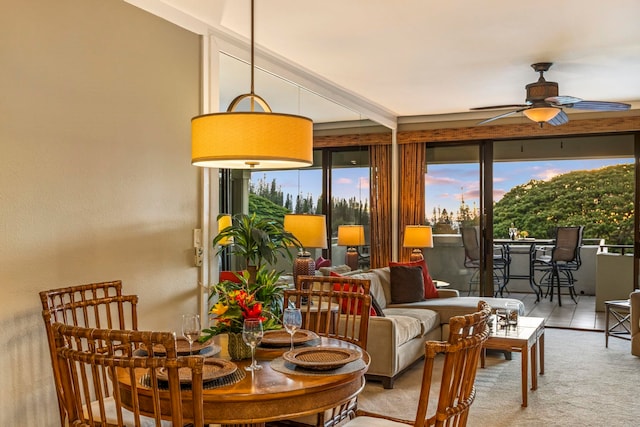 dining room featuring beam ceiling and ceiling fan