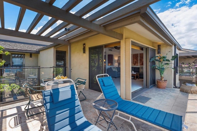 view of patio / terrace featuring a pergola and ceiling fan